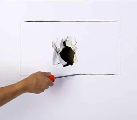 How to fix a hole in drywall - cutting