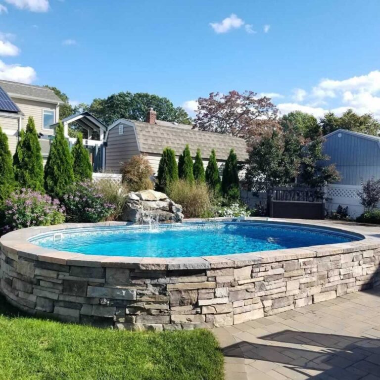 Amazing above ground pool with stone walls