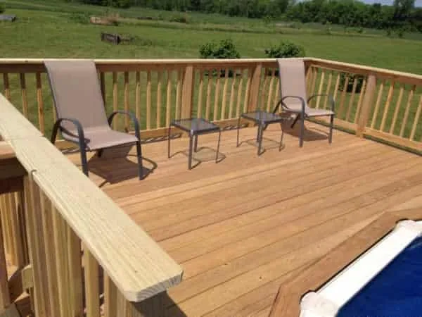 finished DIY pool deck with seating area
