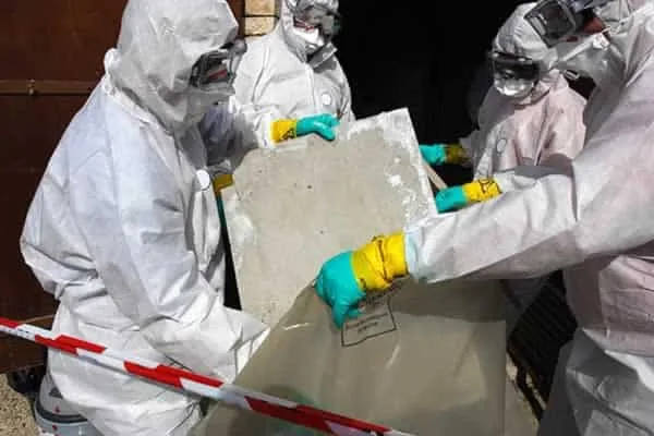 professional removing asbestos from home
