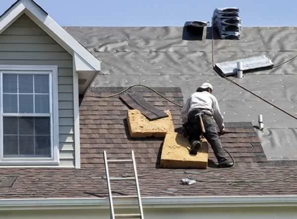 roofer replacing shingle roof