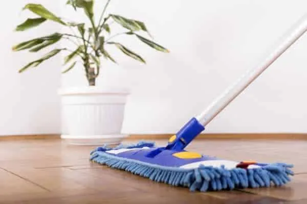 cleaning hardwood floor with a mop