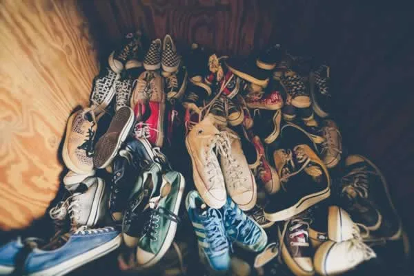 a pile of old shoes in the room