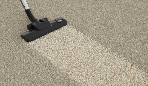 cleaning carpet with vacuum cleaner