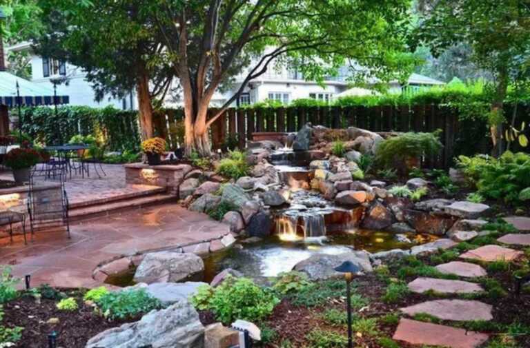 amazing backyard with patio, pathway and outdoor fountain