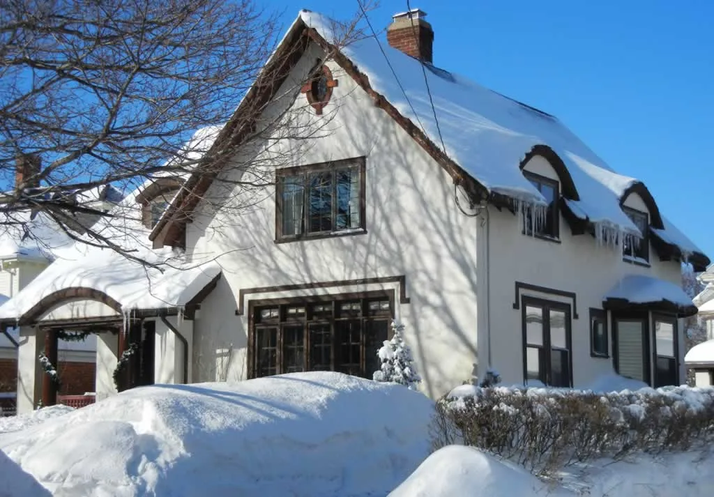 home under the snow in the winter