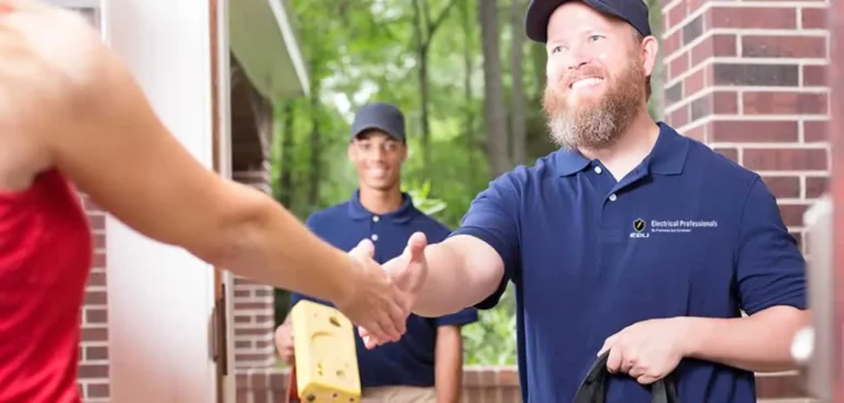 electrician shaking hand with homeowner