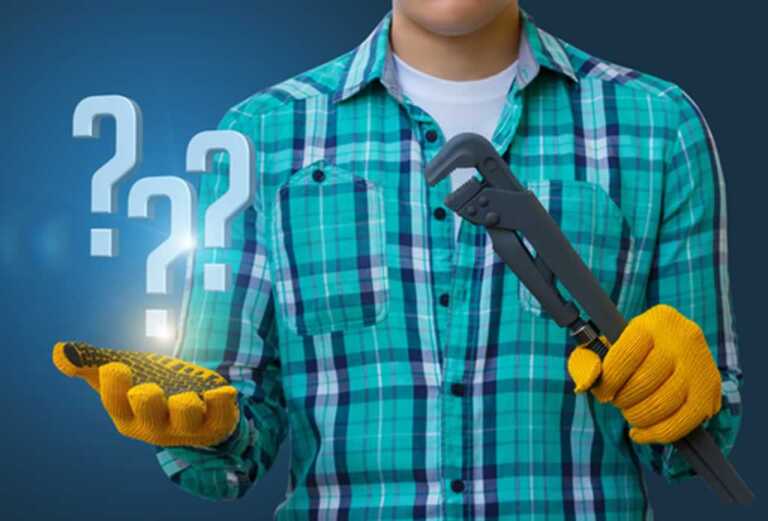 homeowner holding the plumbers wrench thinking what to do
