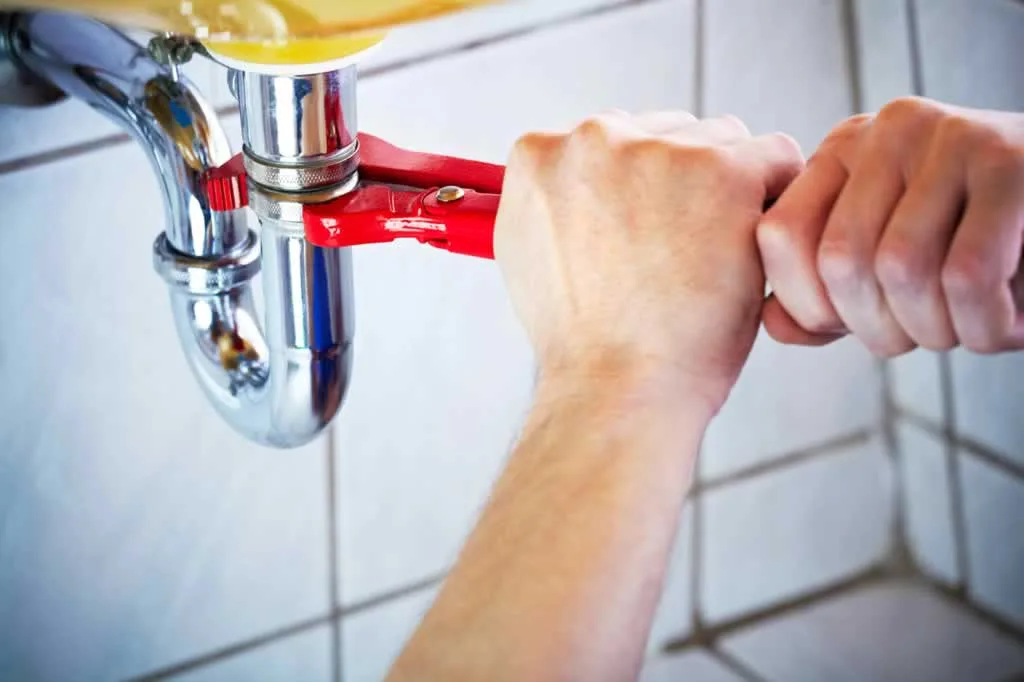 fixing drain pipe with adjustable wrench