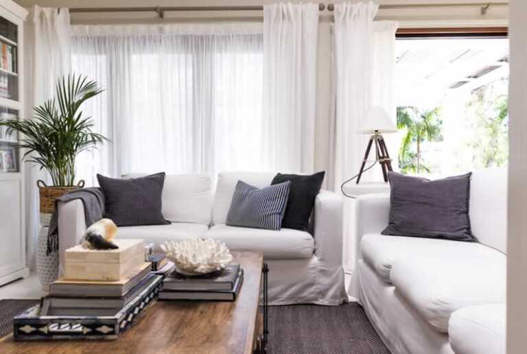 How can I decorate my living room on an eco-friendly budget