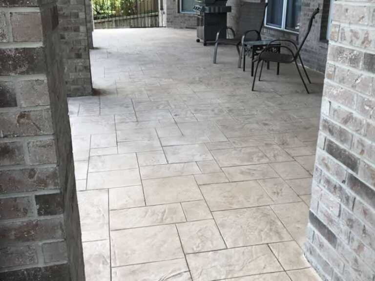patio paved with stamped concrete tiles