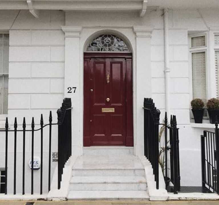 classic hardwood front door on a classic house