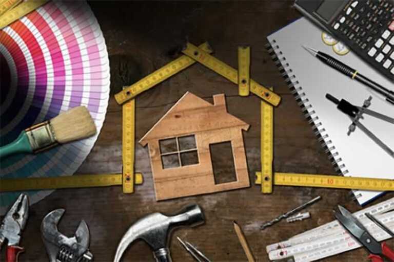 home improvement tools with model house on the table