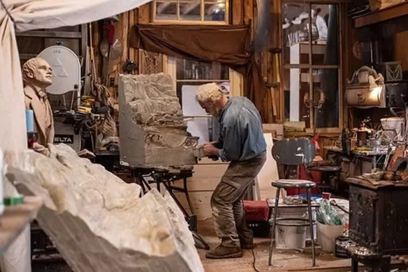 man carving in the workshop