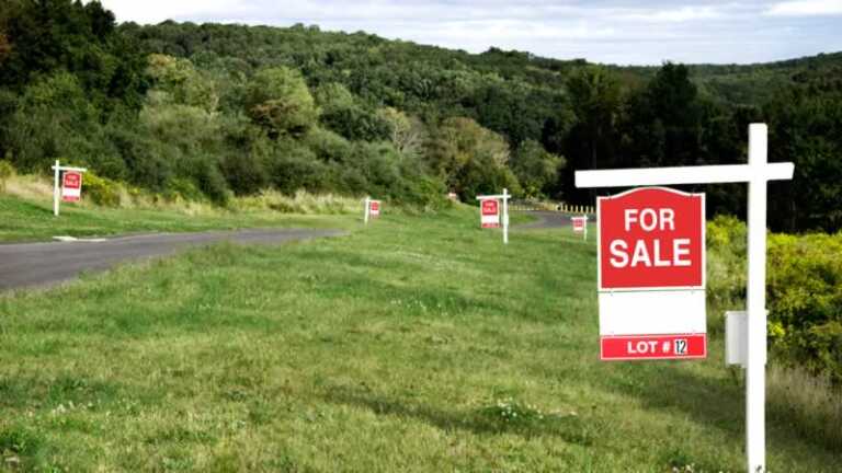 for sale signs on the properties