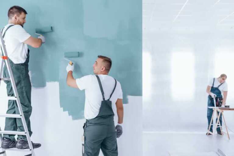 painting contractors painting the wall