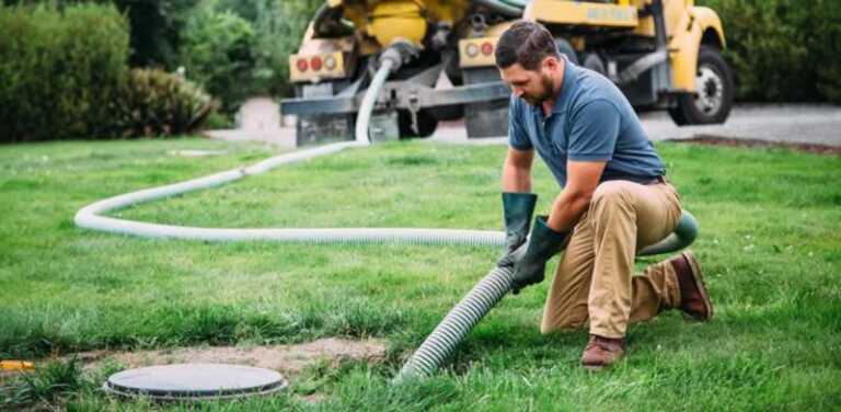 man pumping out septic tank