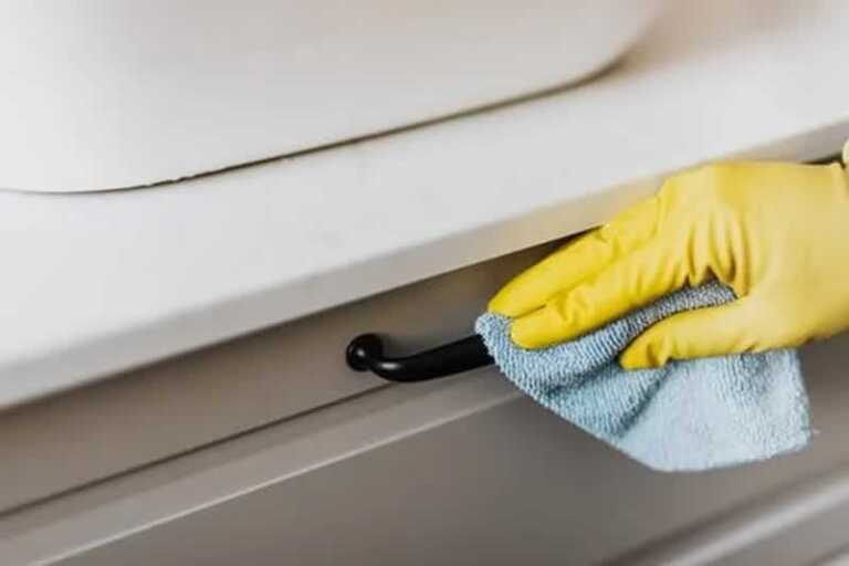 cleaning cabinets with microfiber cloth