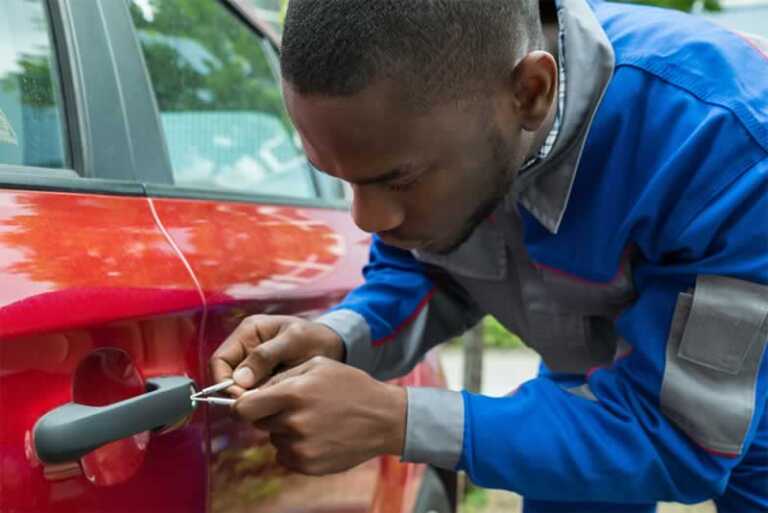 locksmith unlocking a car