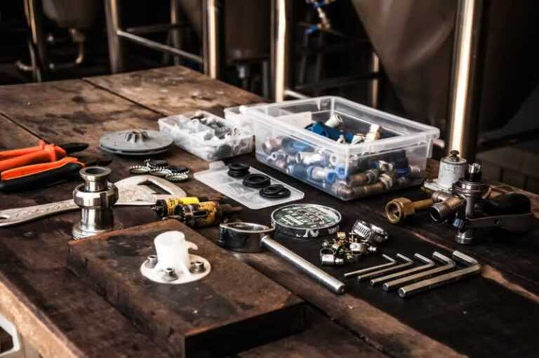 table with plumbing tools and supplies