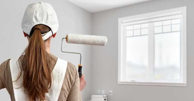 Girl with paint roller