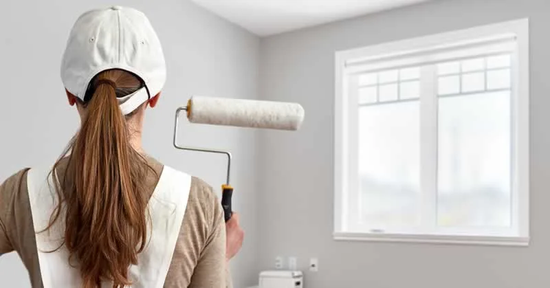 Girl with paint roller