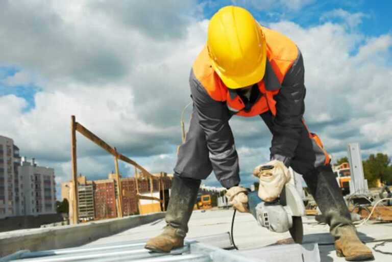 worker cutting with angle grinder