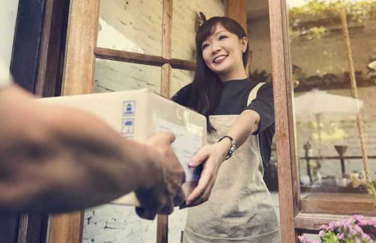 Woman receiving postal package