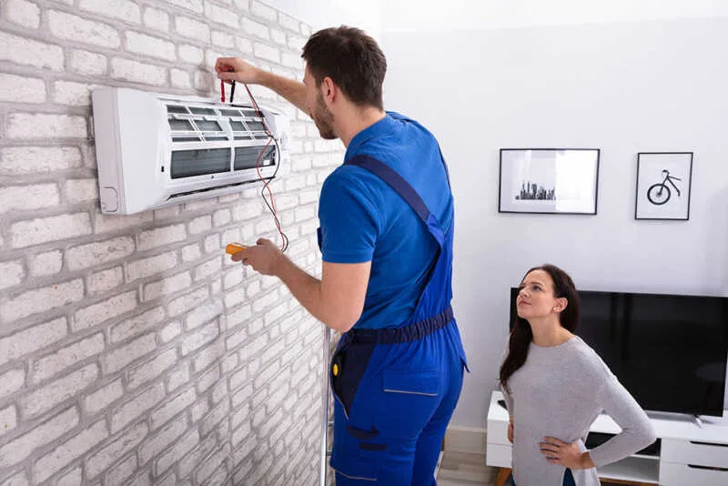 Technician testing HVAC unit