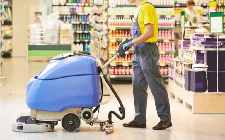 Machine cleaning the floor