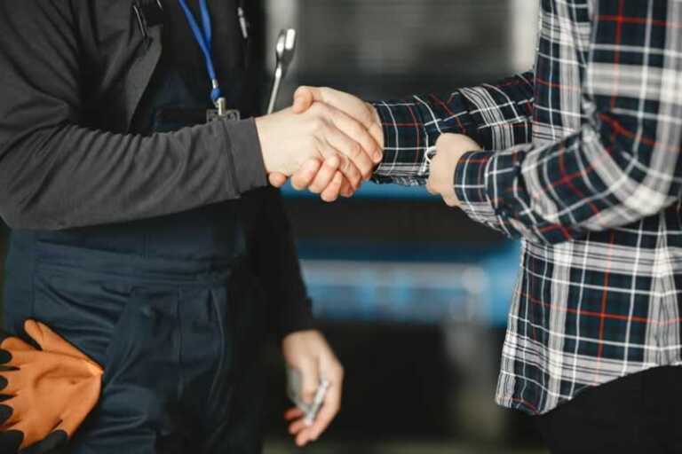 Shaking hands with HVAC technician