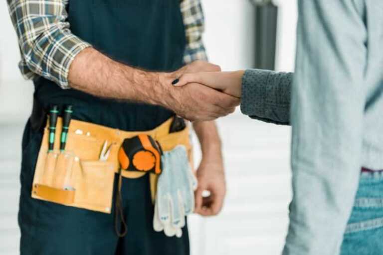 handyman shaking hands