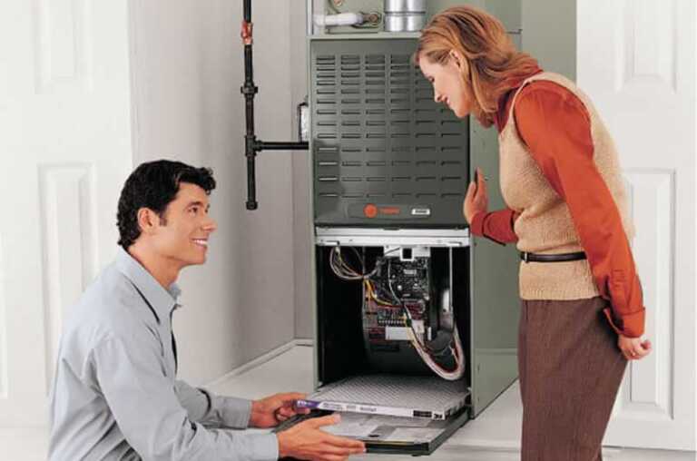 woman and furnace repairman