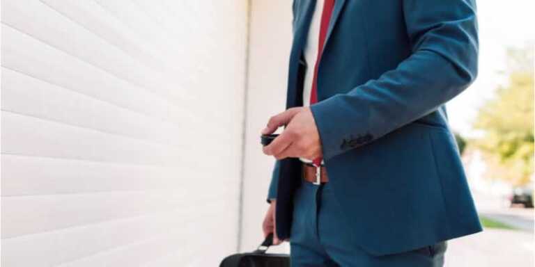 man with garage door remote