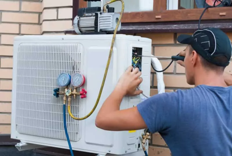 contractor repairing AC