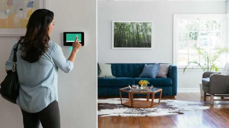 woman turning on security system