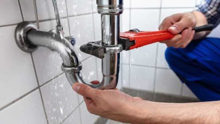 plumber fixing drain