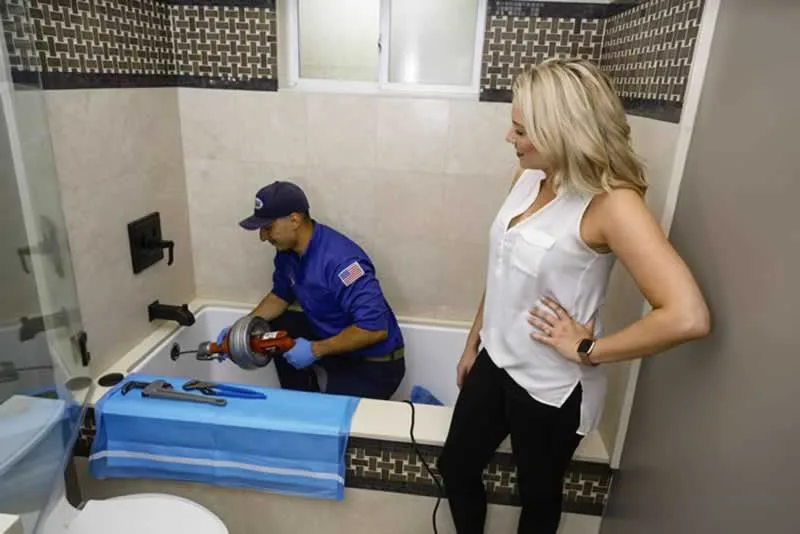 plumber fixing clog