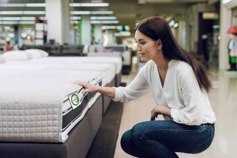 woman choosing mattress