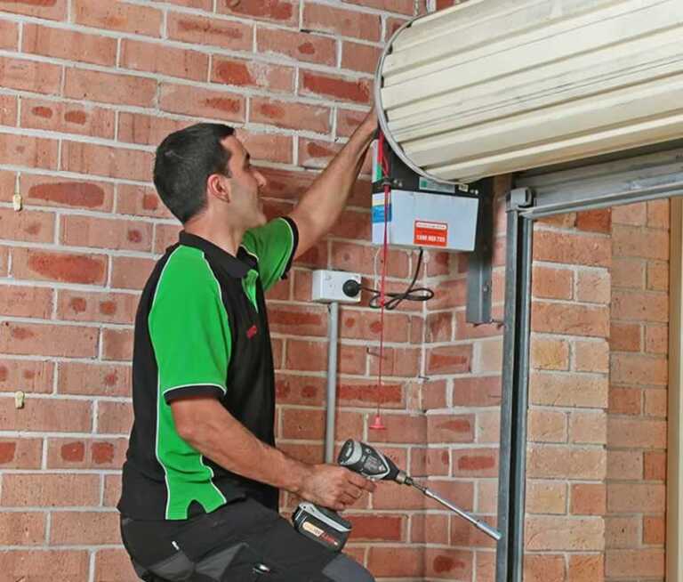 repairman fixing garage door
