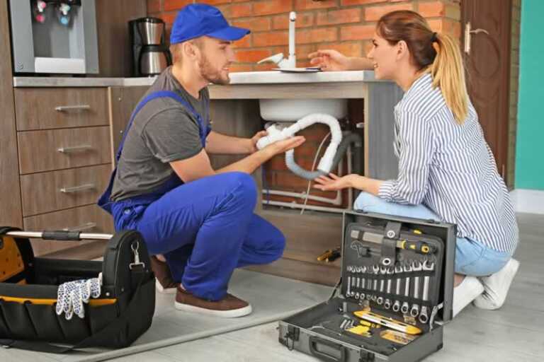 handyman explaining women homeowner