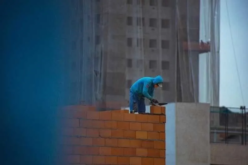 man building a wall