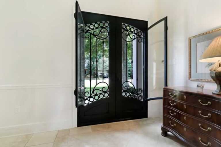 wrought iron door with opened glass