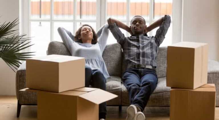 couple relaxing after packing