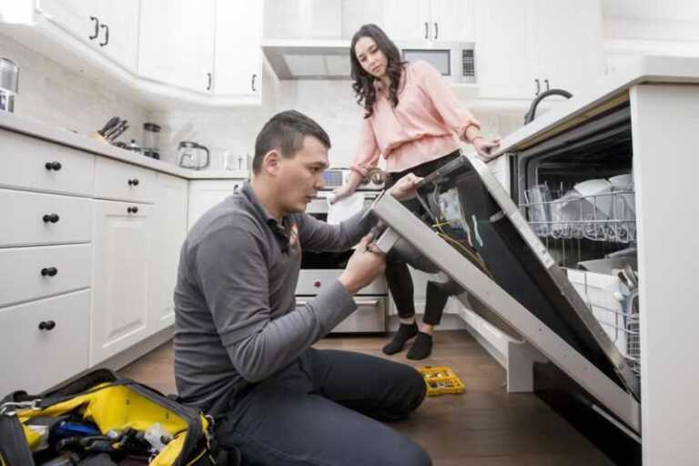 man fixing dishwasher