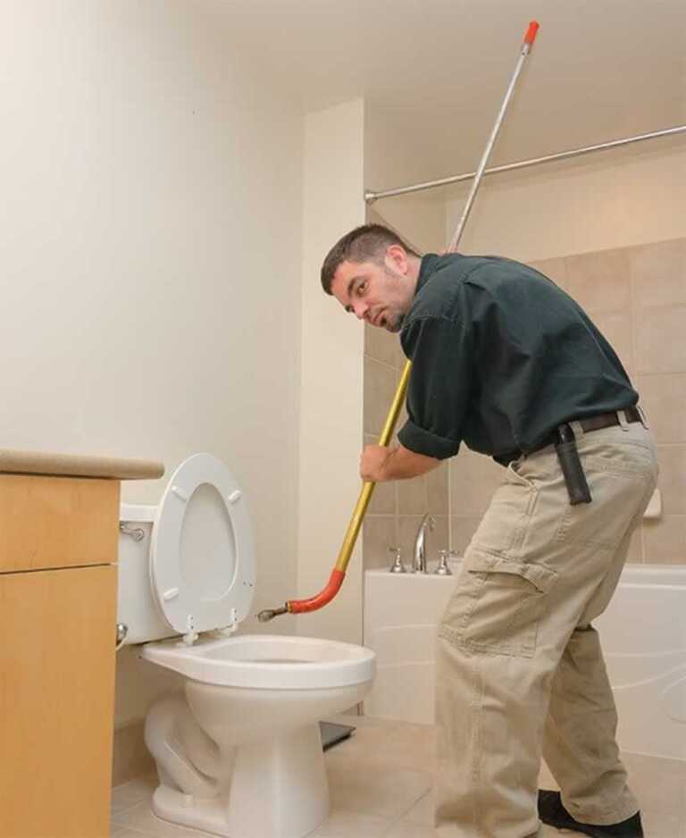 unclogging a toilet