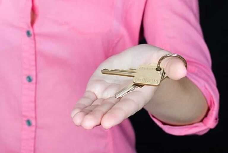 man holding house key