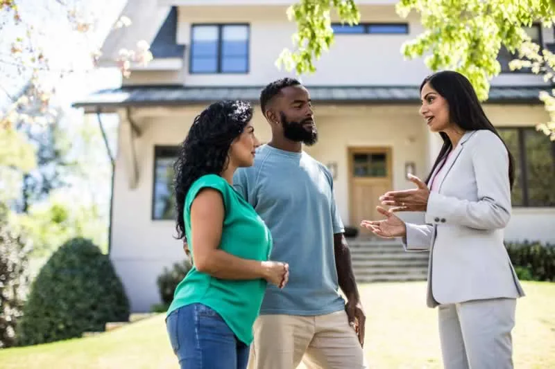 couple with real estate agent