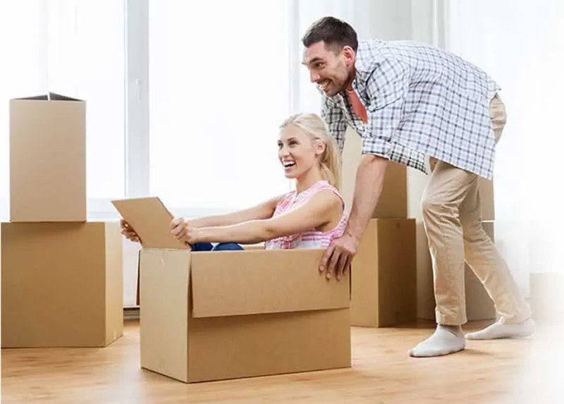 woman riding in moving box