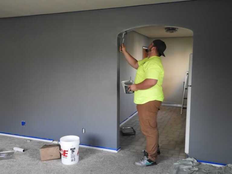 man painting the wall